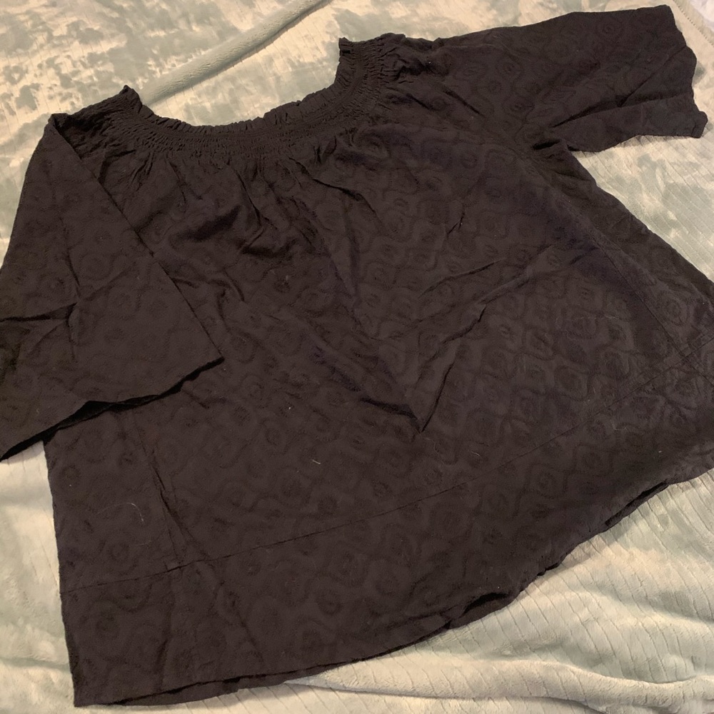Black top with eyelet type material